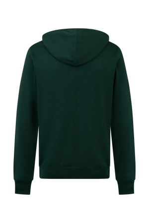 Hoodie Dogleg Clubhouse homme vert foncé porté par un golfeur — hoodie cachemire, golf Suisse