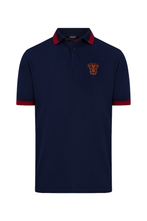 Détail du polo de golf Dogleg Stella crème — finition technique et broderie, golf Suisse