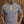 Polo de golf Dogleg Work Hard gris porté par un golfeur — polo technique, golf Suisse